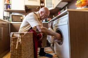 Home care helps seniors with daily tasks like laundry.